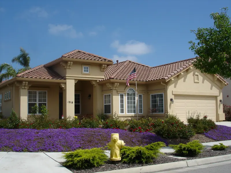 Ranch-style home with a front yard facing a quiet residential street